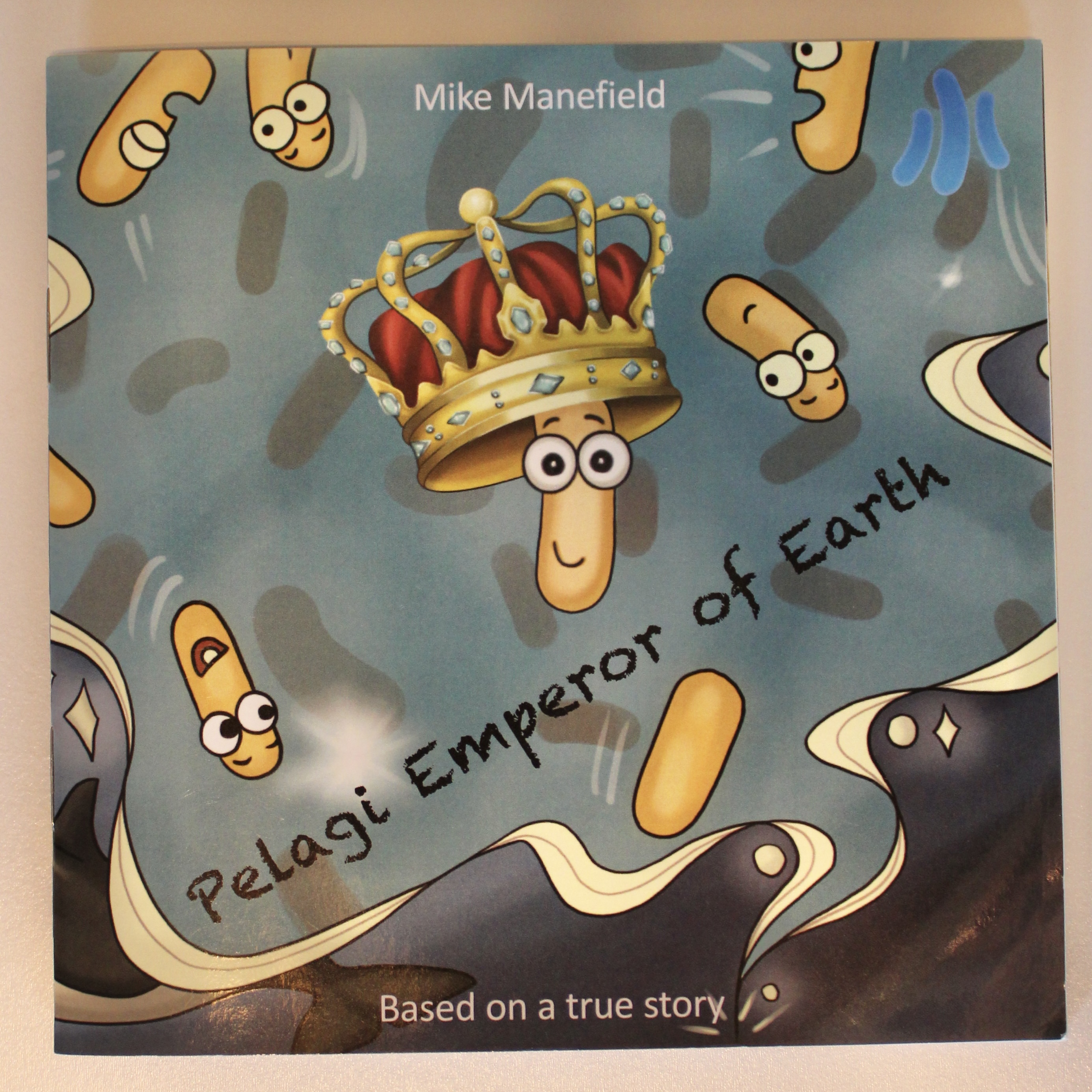 children's book cover with bacteria wearing a crown that says Pelagi Emperor of Earth by Mike Manefield